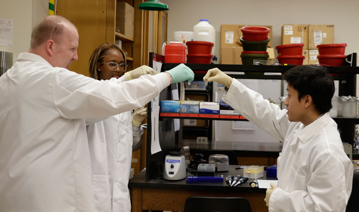 Dr. Joseph Ross and students in the lab.