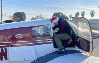 Dr. Tama Forgacs in plane packing gifts