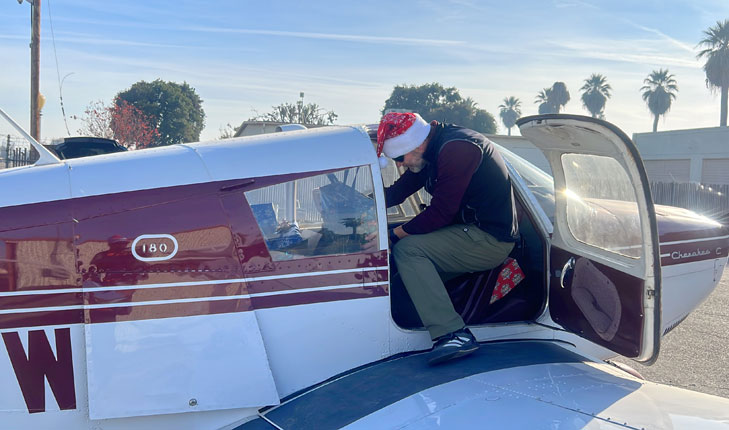 Dr. Tama Forgacs in plane packing gifts