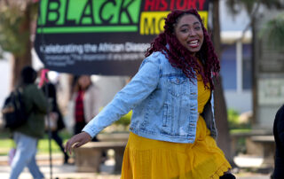 A Fresno State student dances during Black History Month celebration.