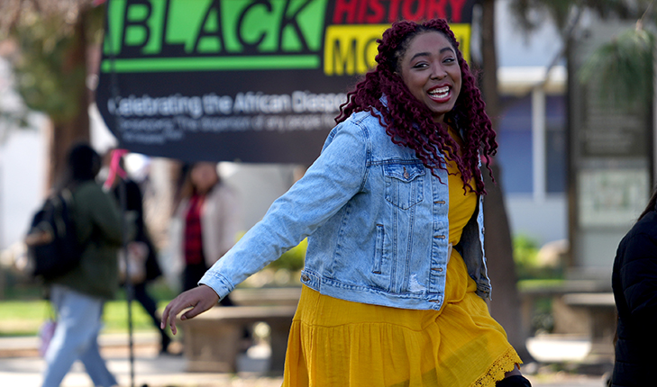 A Fresno State student dances during Black History Month celebration.