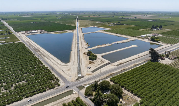 Aerial image of water storage amid fields of crops.