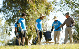 Fresno State students volunteer for environmental projects at Scout Island.
