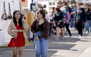 Two girls walking around Vintage Days