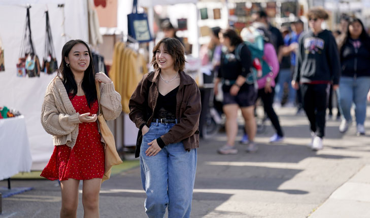 Two girls walking around Vintage Days