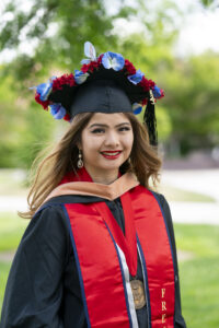 Andrea Lee, Craig School of Business, in graduation robes.