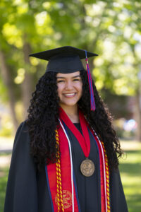 Bianca G. Palma, Student Affairs and Enrollment Management, in graduation robes.