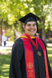 Fernando Robledo Garcia, Division of Student Affairs and Enrollment Management, in graduation robes.