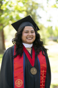 Jennifer Duran, College of Health and Human Services, in graduation robes.