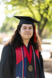 Jose A. Santiesteban, College of Social Sciences, in graduation robes.