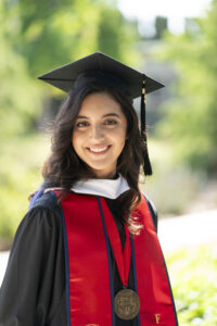 Kiana Krisosto, College of Science and Mathematics, in graduation robes.