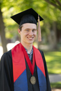 Matthew Forney, Jordan College, in graduation robes.