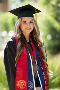 Reyna I. Mero, Jordan College, in graduation robes.