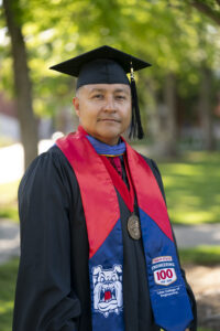 Rodolfo Lopez, Lyles College of Engineering, in graduation robes.