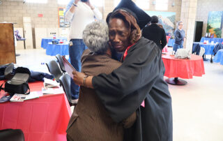 In a crowded gathering area at the Central California Women's Facility near Chowchilla, family members, friends and supporters came together on March 11 to celebrate the first class to receive undergraduate college degrees from a women’s correctional facility in California.