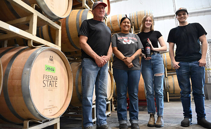 Fresno State winemaker Tom Montgomery (left) with students Malia Mora, Preston Jenkins and Keara McVicker.
