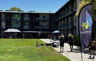 Students walk outside of the Fresno State dorms.