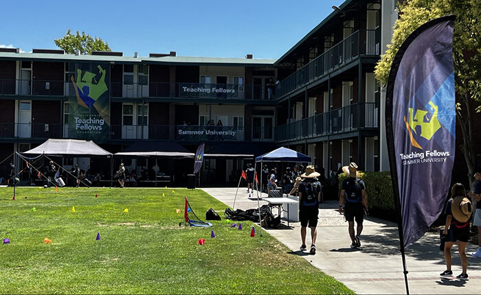 Students walk outside of the Fresno State dorms.