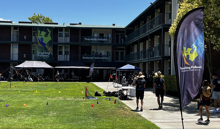 Students walk outside of the Fresno State dorms.