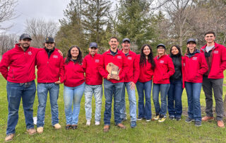 Plant Science club competitors stand with award.